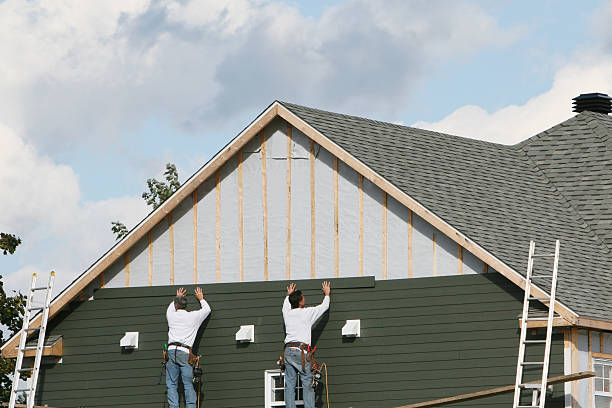 Professional Vinyl Siding technician working in Stow, MA